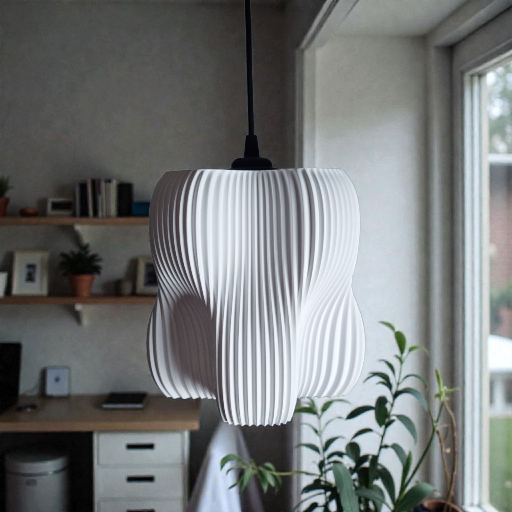A modern pendant lamp with an organic, structured design featuring four lobes and a finely striated white surface. It hangs from a black cord in a bright room adorned with plants and wooden furniture, creating a stylish focal point.