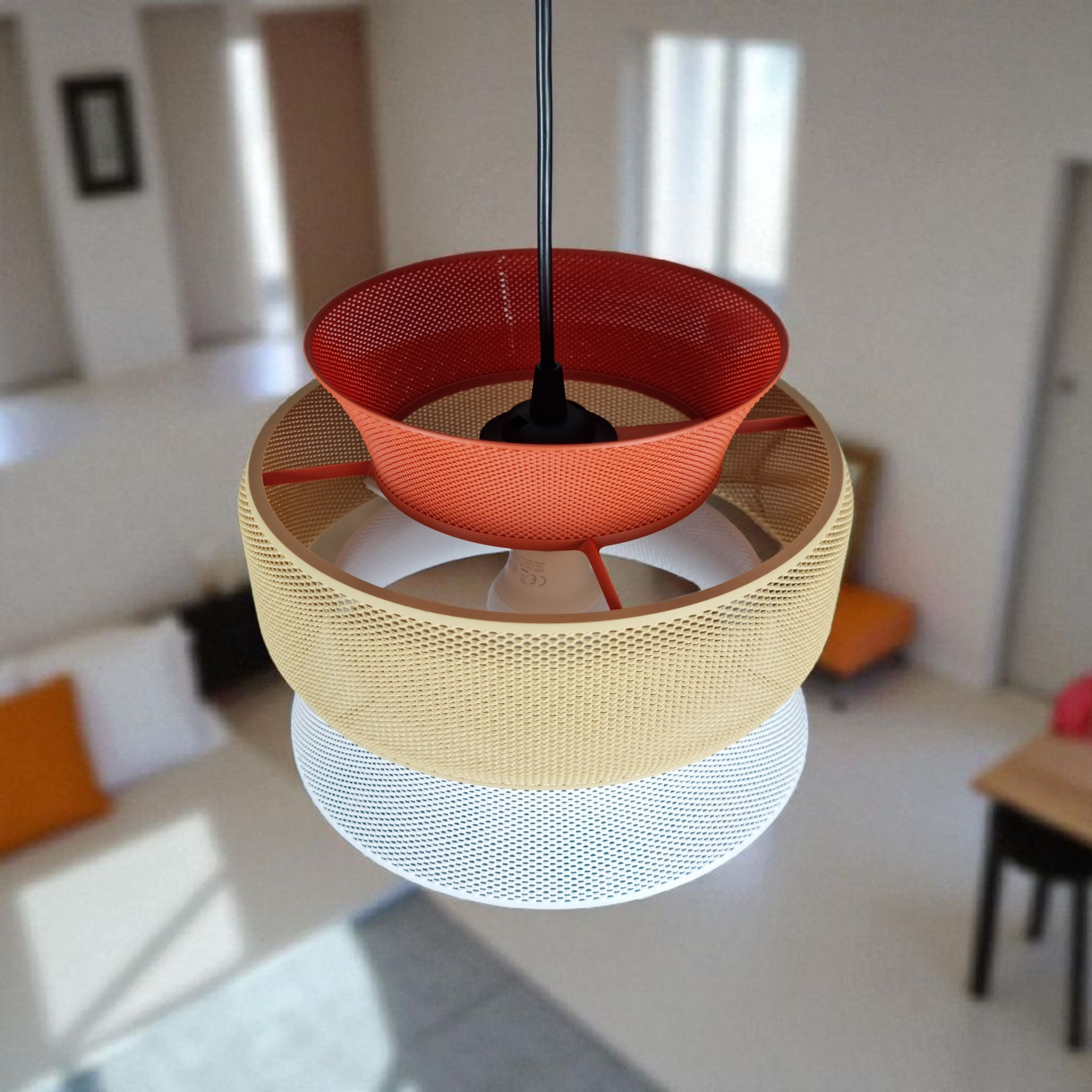 A modern pendant light featuring a layered design with three distinct mesh segments in red, yellow, and white.