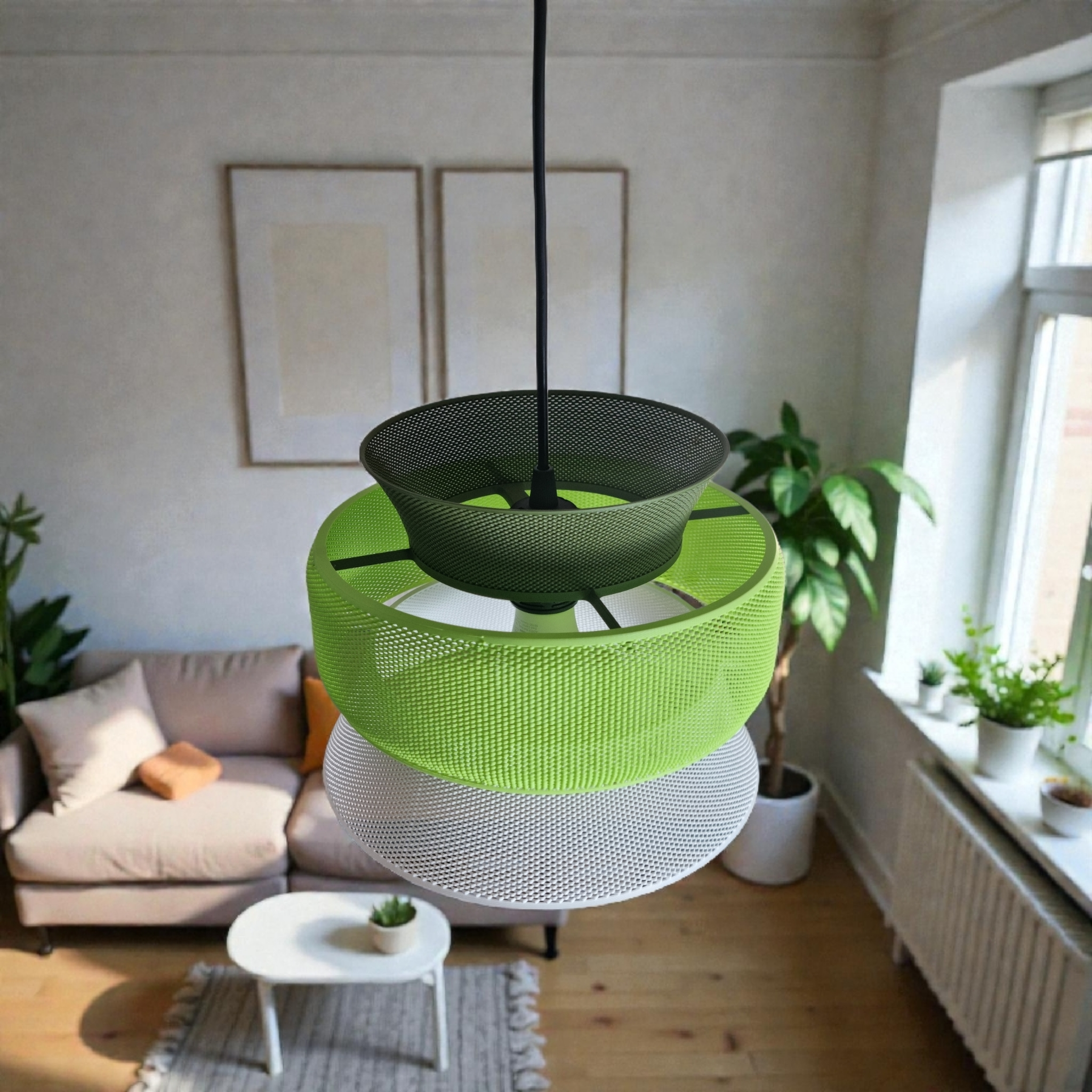 A modern pendant light featuring three layered segments in vibrant green, black, and white mesh materials hangs from a ceiling in a cozy living room.