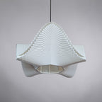 Close-up of the SINE pendant, white 3D printed lampshade with fine wave-like ribbing, contemporary Quarks lighting.