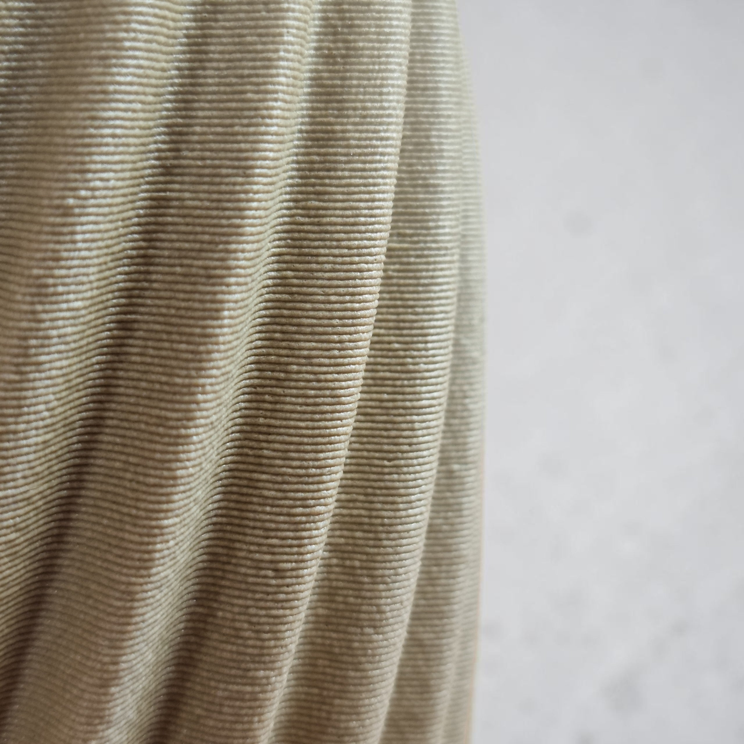 Close-up of TEXTURIA spiral wood vase showing ridged 3D printed texture in Birch beige wood finish